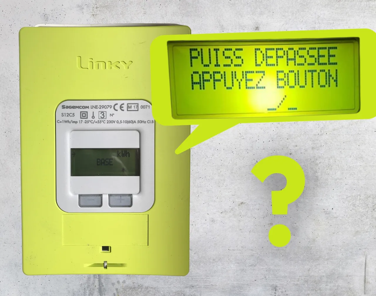 The Linky meter displaying "Puiss depassee, appuyez bouton" — power exceeded, press the button.