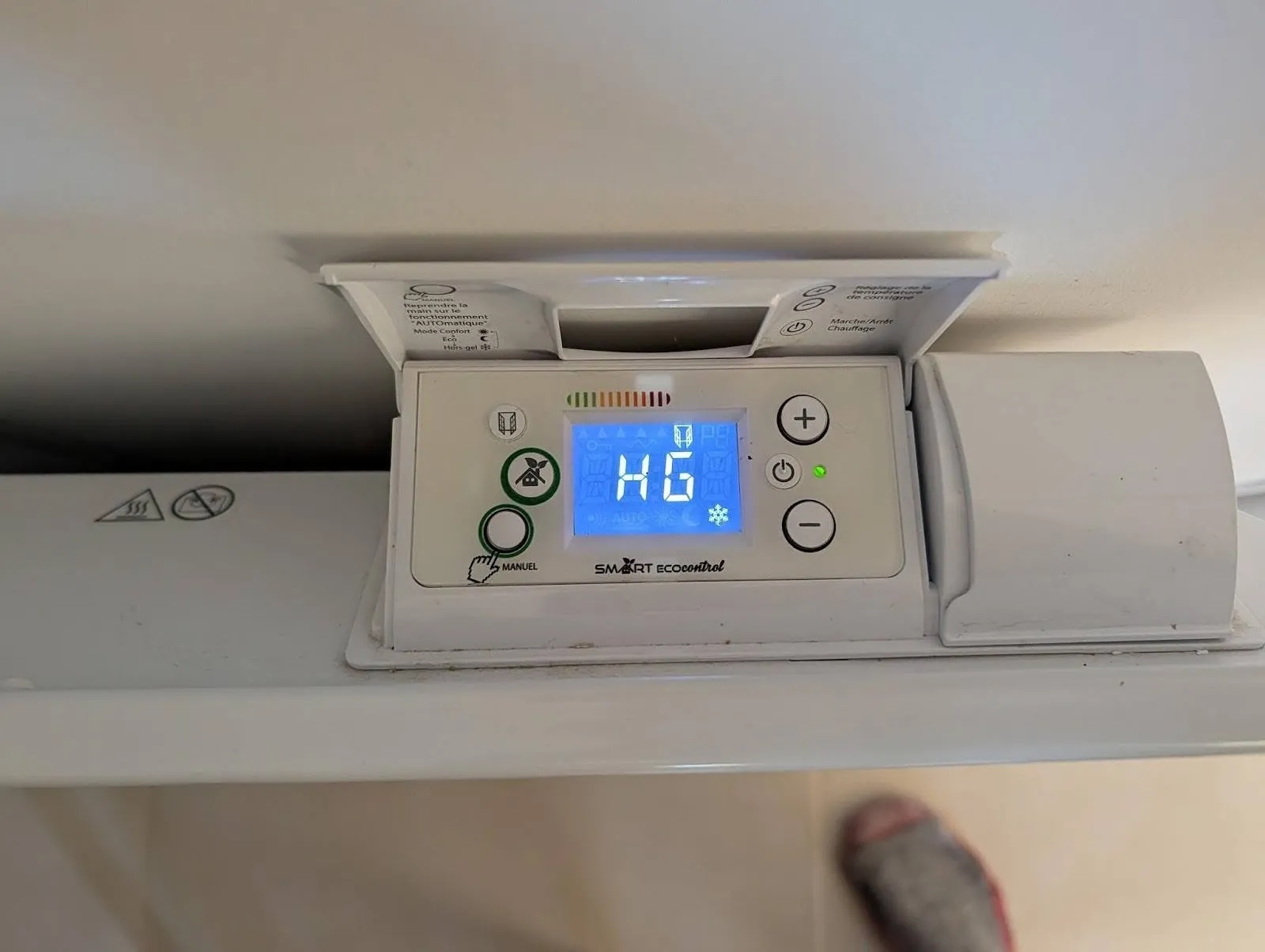 Main thermostat The main thermostat's control panel, currently showing "HG" for frost-protection mode