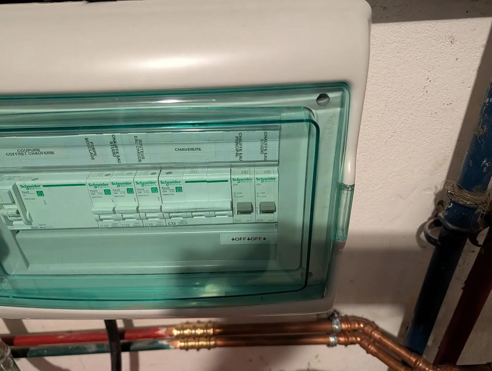 The boiler room fusebox, labeled in French — the two rightmost switches control the water heaters